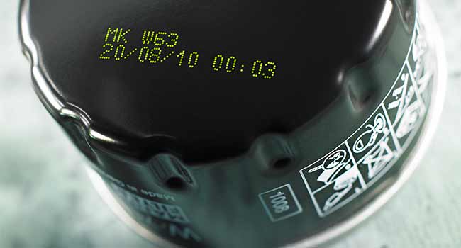Showing printed legacy yellow inks on the top of a black cap | Markem-Imaje
