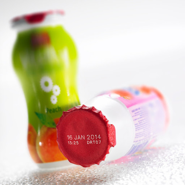 CIJ printed label on the metal cap of a glass yogurt drink bottle