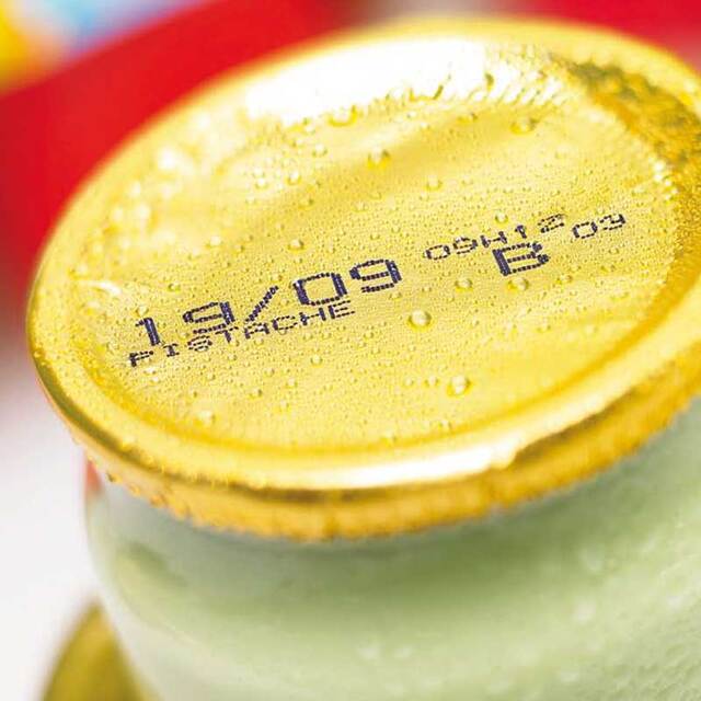 CIJ printed label on the metal lid of a glass jar
