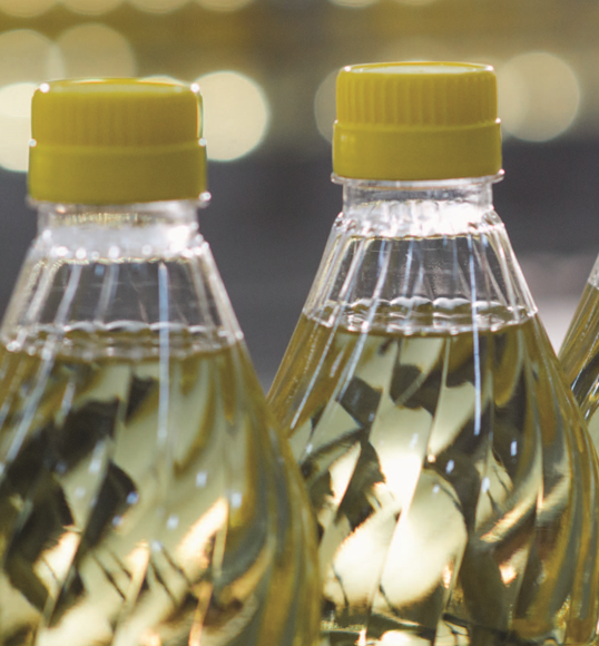 Images of plastic bottles on a conveyor belt