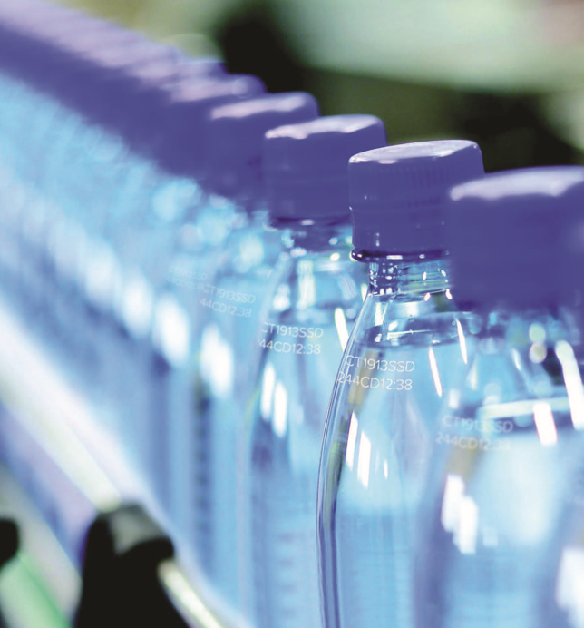 Images of plastic bottles with laser marked labels on the side