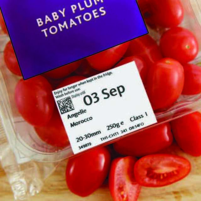 Printed expiry date labels on tomato plastic packaging box