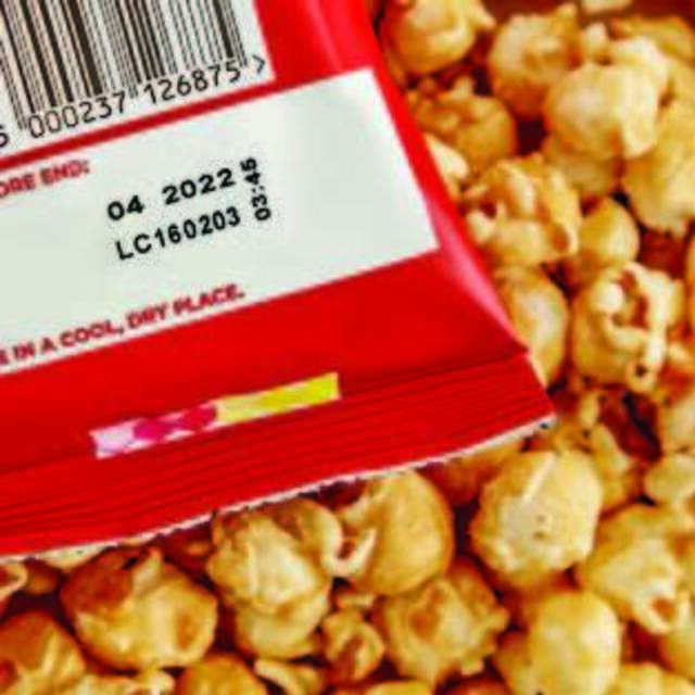 Printed expiry date labels on snack biscuit packaging